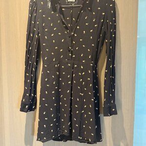 Reformation mini long sleeve fitted black floral dress small slit in back.